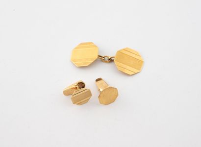 Two collar buttons and one cufflink in yellow...