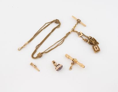 Lot including : 
- A yellow gold (750) chatelaine...