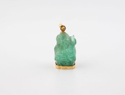 Carved emerald root pendant featuring a dignitary,...