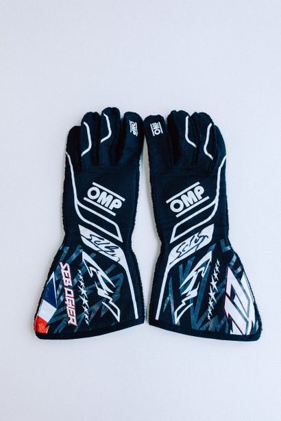 OMP gloves worn and signed by Sébastien Ogier...