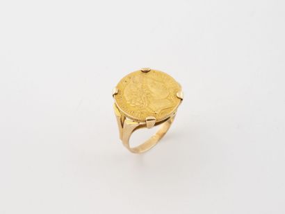 Yellow gold (750) ring centered with a 10-franc...