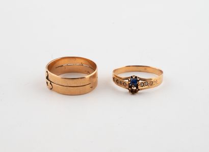 Lot of two yellow gold (750) rings, one band-set,...