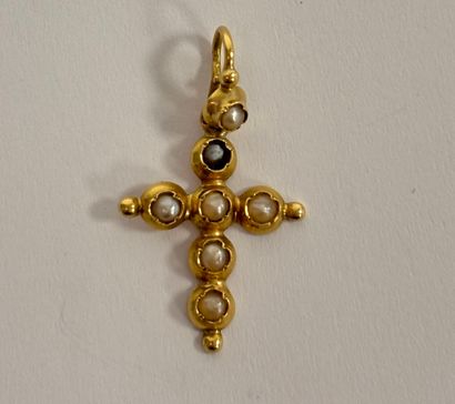 Cross in yellow gold (750) set with small...