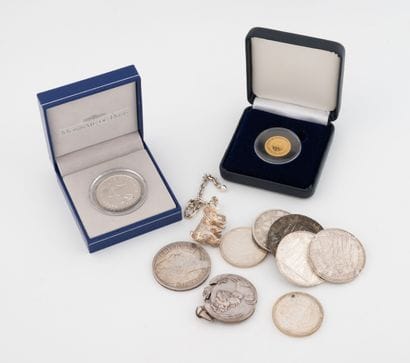 Silver lot including:
- Two 10 franc silver...