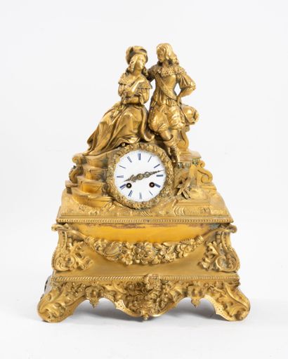 Pendule de cheminée en bronze et laiton ciselé...