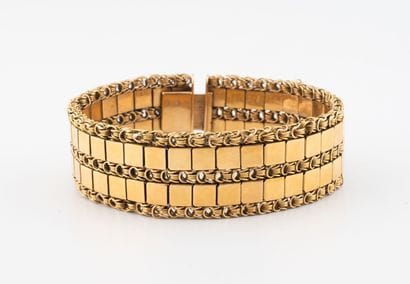 Bracelet ruban articulé en or jaune (750)...