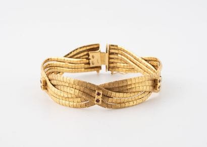 Bracelet façon ruban en or jaune (750) formé...