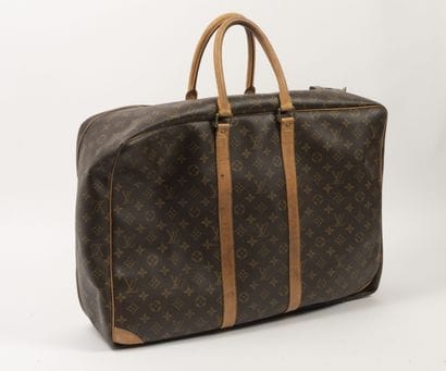Louis VUITTON 
Petite valise souple en toile...