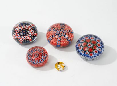 Five clear glass paperweight spheres with...