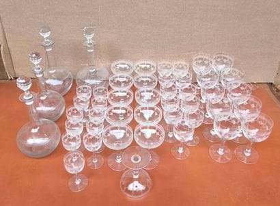 A set of crystal stemware engraved with garlands,...