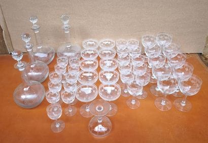 A set of crystal stemware engraved with garlands,...