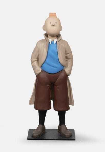 Tintin debout les mains dans les poches.
Édition...