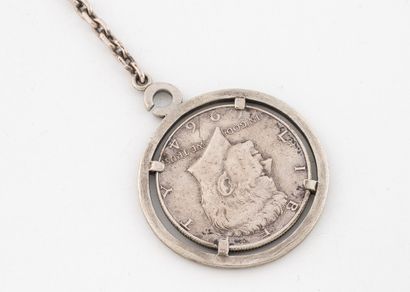 Silver (800) keychain featuring a 1964 Kennedy...