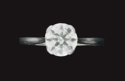 Bague en platine sertie d'un diamant demi...