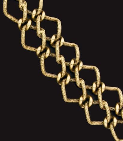 Bracelet en or jaune formé de deux chaînes...