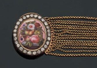 Bracelet en or orné d'un médaillon ovale...