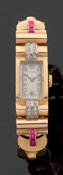 Montre bracelet de dame en ors jaune et gris....