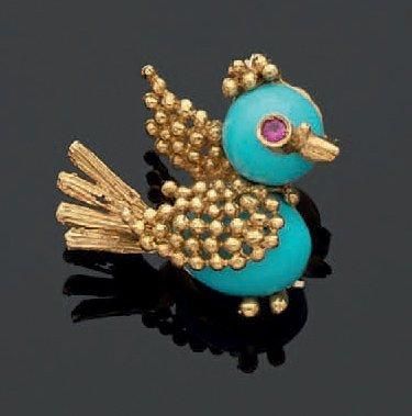 Petite broche en forme d'oiseau en or jaune...