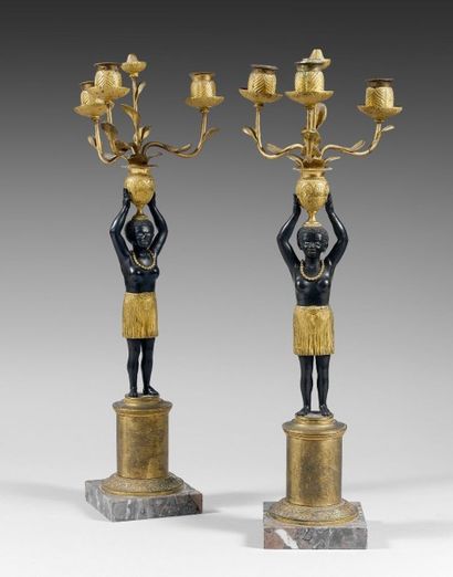 Paire de candélabres en bronze doré et patiné...