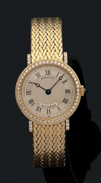 BREGUET
Montre-bracelet de femme en ors jaune...