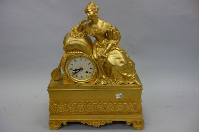 Pendule borne en laiton et bronze dorés à...