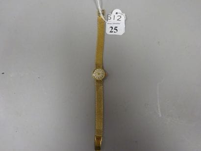 BUTEX

Montre bracelet de dame en or jaune...