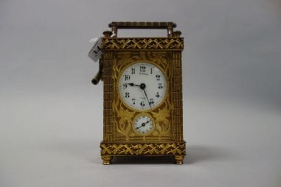 Pendulette d'officier en cuivre doré et verre...