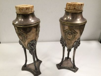 Deux vases tripodes en métal désargenté à...