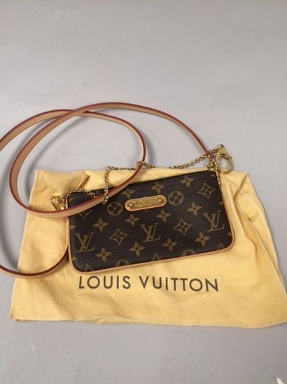 LOUIS VUITTON
Petit sac à main en toile Monogram...