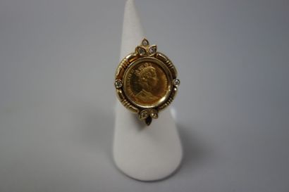 Bague en or jaune (585) ornée d'une pièce...