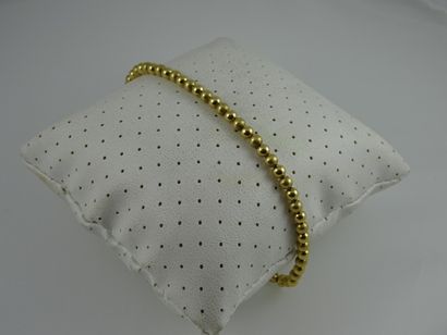 Bracelet formé de perles d'or jaune (750)...