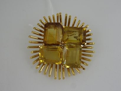 Broche ronde à motif rayonnant en or jaune...