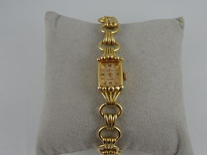 ROLEX
Montre bracelet de dame en or jaune...