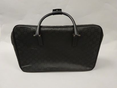 GUCCI
Valise souple en toile noire monogrammée,...