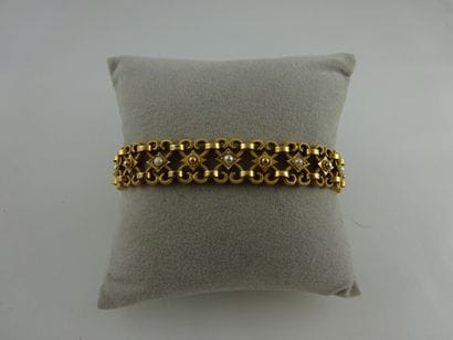Bracelet souple à volutes en or jaune (750)...