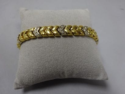 Bracelet articulé en or jaune et gris (750)...