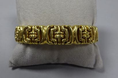 Bracelet en or jaune (750) en partie articulé...