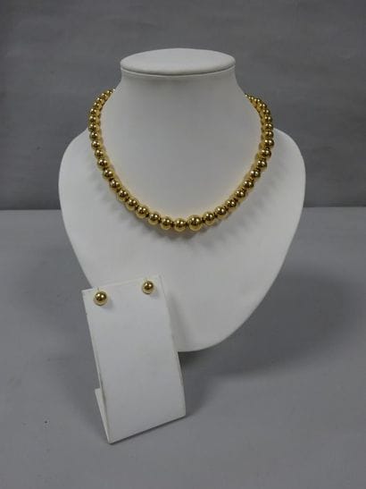 Parure en or jaune (750) comprenant un collier...