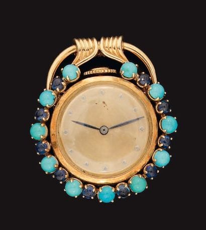 Montre de revers en or, cadran doré avec...