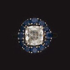 BAGUE en or jaune et or gris, ornée d'un...
