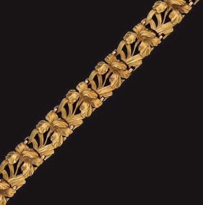 BRACELET en or jaune articulé de dix motifs...