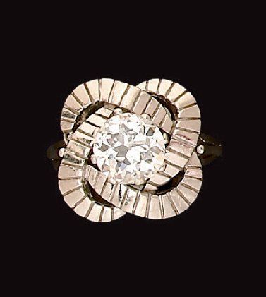 Bague en or gris ornée d'un diamant demi...