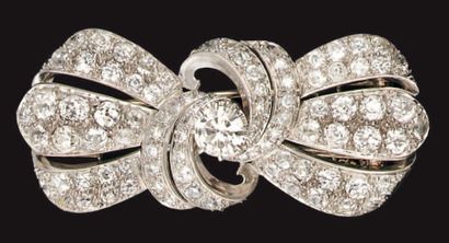 Clip de revers en or et platine faisant broche,...