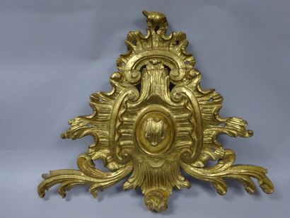 Elément décoratif en bois sculpté et doré...