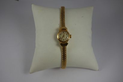 Montre de dame en or jaune (750).

Boîtier...
