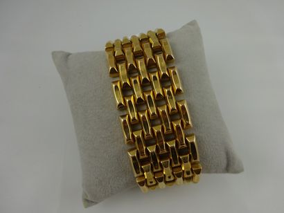 Bracelet souple ajouré en or jaune (750)...