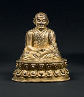 TIBET
Statuette de Lhama en bronze doré,...