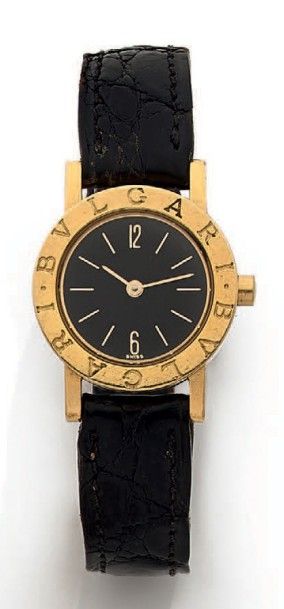 Montre de dame ronde en or jaune (750 millièmes),...