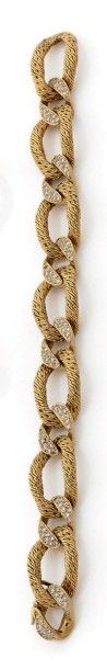 Bracelet en or jaune (750 millièmes) articulé,...