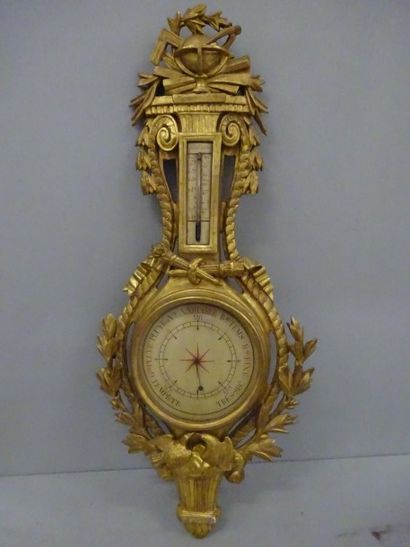 Baromètre-thermomètre en bois doré à décor...